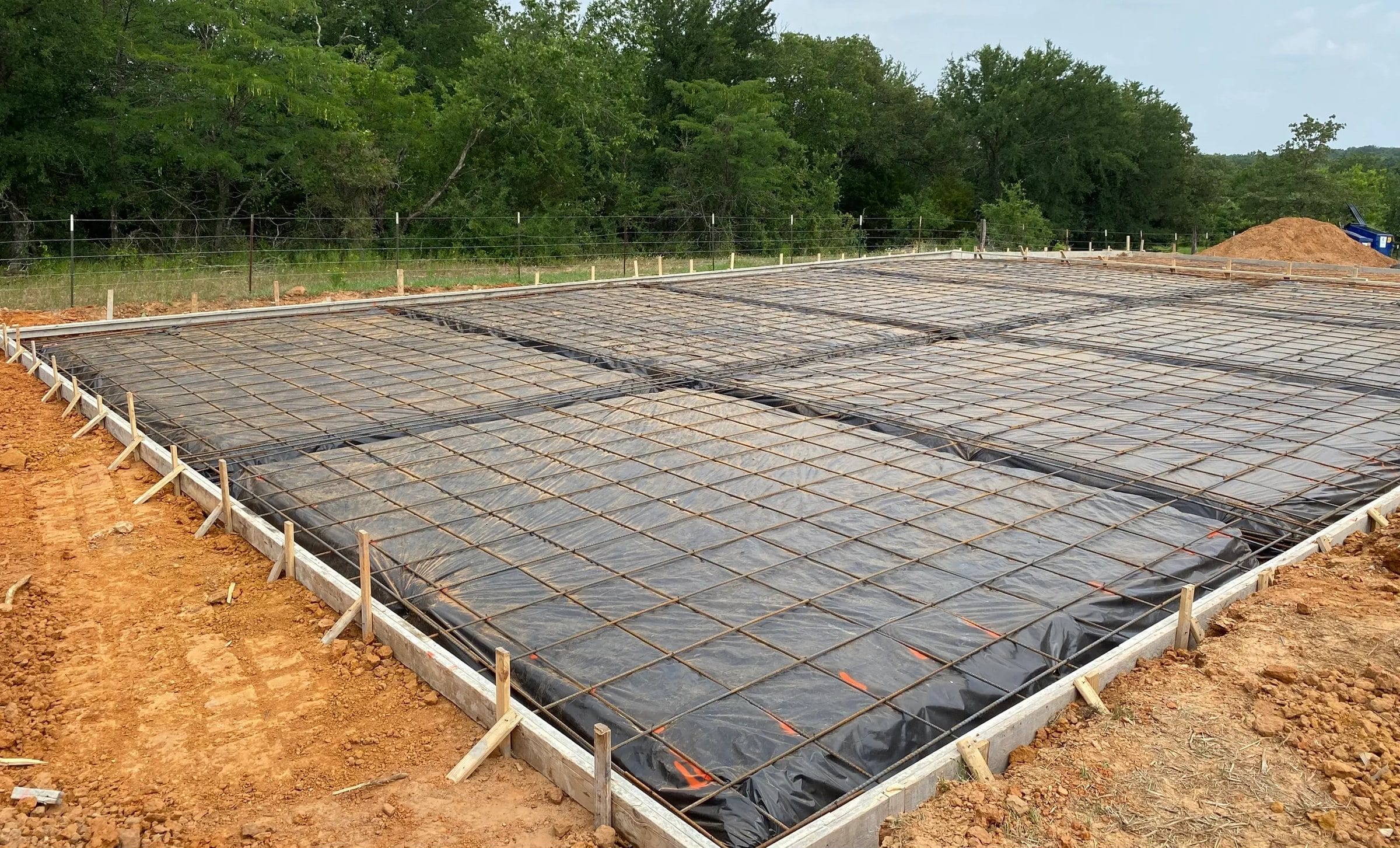A formed and poured commercial foundation slab on a Fine Cut jobsite