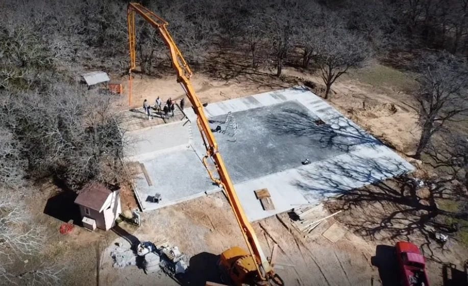 Concrete pump truck placing a slab