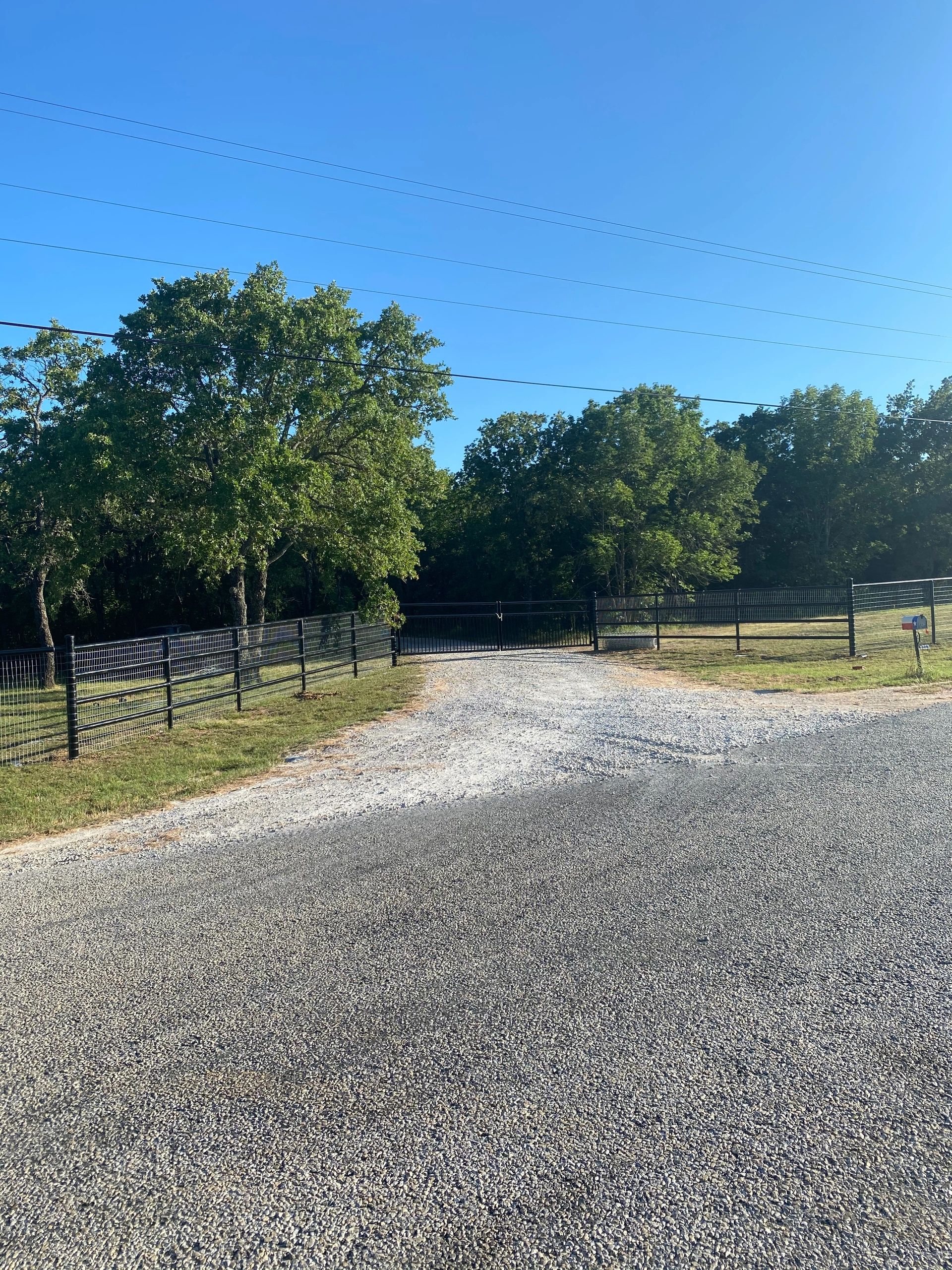 Ranch entryway with pipe fence