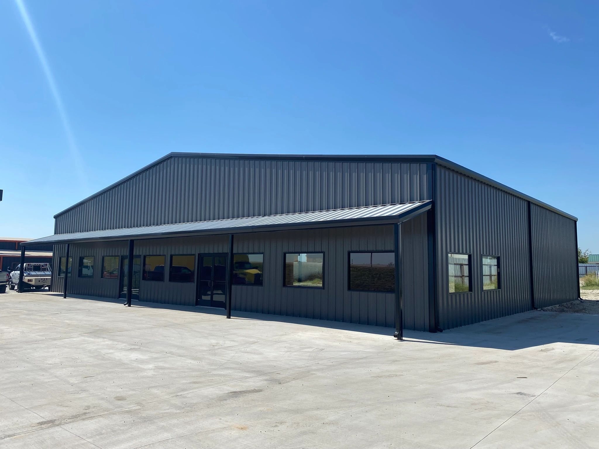 A completed Fine Cut commercial metal building with concrete apron in North Texas